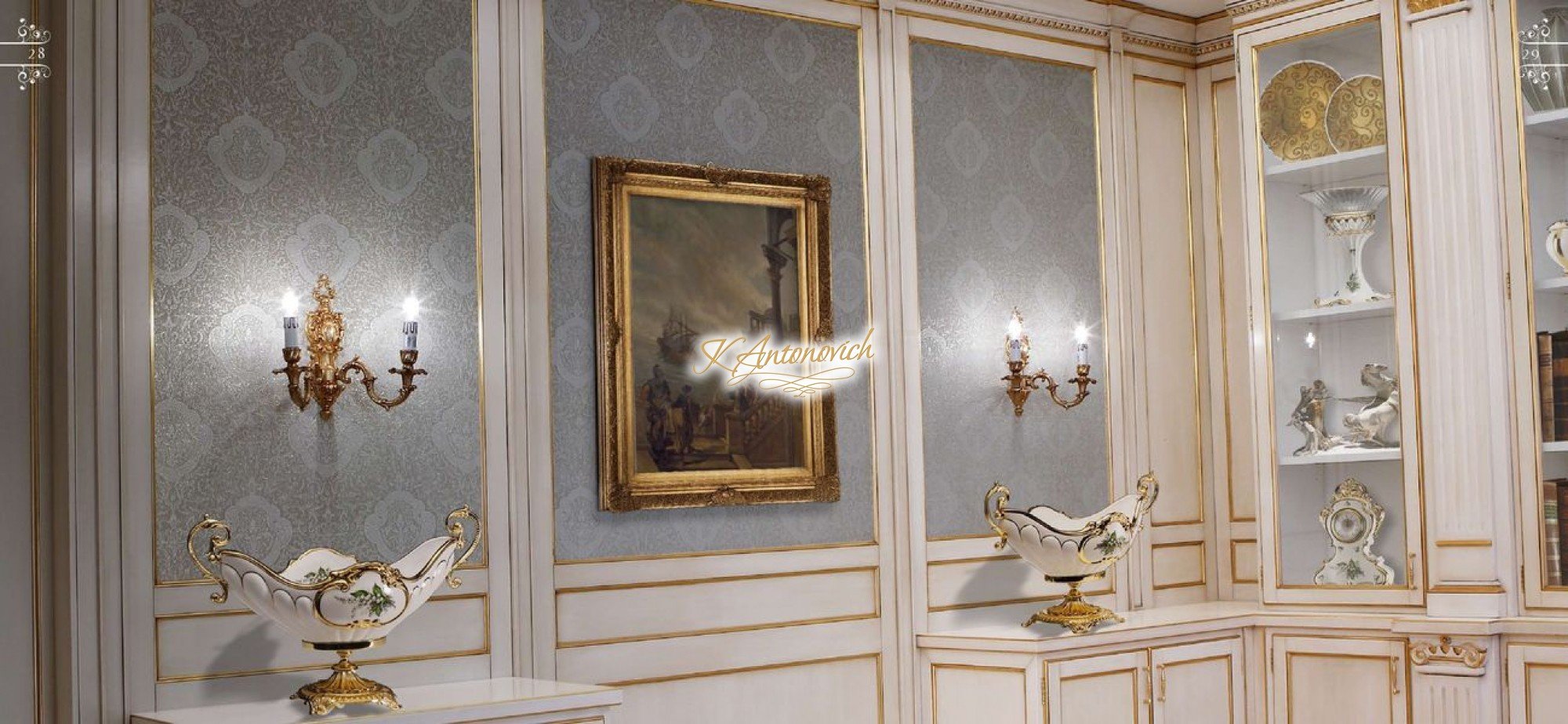 This picture shows a luxurious bathroom with a modern design. The main feature of the room is an elegant soaking tub which is set in the center of the space on a marble platform with steps. There are also two white vessel sinks with chrome faucets on either side of the tub, as well as a large vanity with a black marble top and storage drawers. The walls and floors have a light wooden finish, and there is a large window with white shutters for natural light. The overall look is modern and sophisticated.