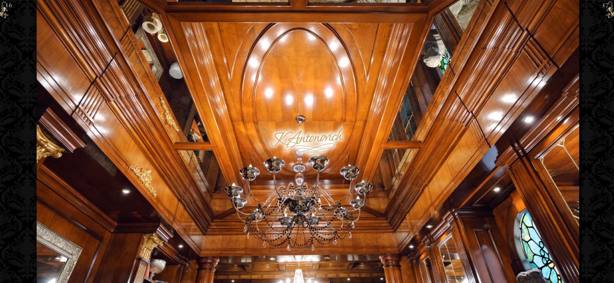 This picture shows a luxurious living room interior design. It features beige walls and soft wooden floors, elegant furniture pieces upholstered in rich fabric, an ornate crystal chandelier hanging from the ceiling, an intricately carved mantelpiece above the fireplace, and a large window looking out onto a garden. Other elements include decorative mirrors and sconces on the walls, and a grand plant in the corner.