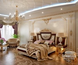It's a luxurious interior design with a black and white theme. There's a beautiful chandelier hanging above, and grand furniture.