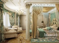 Luxurious bedroom with a double bed, bedside tables and chests of drawers in white and gold color.