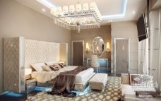 Luxury living room with artistic marble walls, velvet furniture and amazing crystal chandelier, creating a stunning atmosphere.