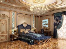 Luxurious marble lobby with exquisite crystal chandelier, grand reception desk, detailed paneling and plush velvet seating.