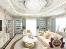 Modern bedroom with luxurious furniture and decorative elements in gold, pink and light grey colors.