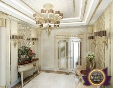 A luxury spiral staircase with gold railing and steps covered in beige carpet, perfect for a modern and grand interior.