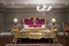 Modern interior design in beige and gold colors with curved shapes and luxurious furniture elements.