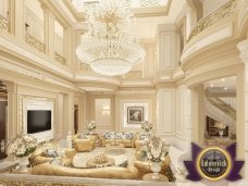 This picture depicts a luxurious bedroom interior design with a modern bed design in stunning white and gold hues. The bed is adorned with a beautiful white headboard and bedding, while the walls are outfitted with matching gold wallpaper and paintwork. The light fixtures and furniture feature bold shapes that create an opulent atmosphere. Other accents, such as the gold-trimmed mirrors, curtains and ornate details, complete the look.