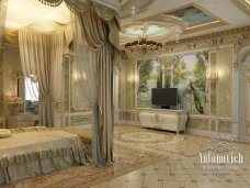 A luxurious bathroom featuring an ivory and gold vanity, a large soaking tub, and stunning crystal lighting.