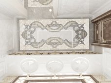 Luxurious home interior featuring a grand marble hallway, a crystal chandelier, and beige walls with white railings.