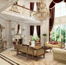 This picture shows an elegant living room with a white sofa and two armchairs, set off by a round glass coffee table. The décor is minimalist, featuring white walls and some geometric plants. A modern floor lamp with a brass design stands in the corner, providing lighting to the space.