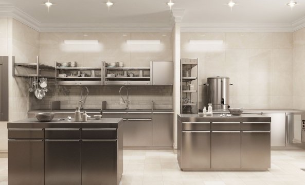 This picture shows a classic and modern open plan dining room design. The space is an elegant mix of both classic and modern elements. The walls are painted in a light cream color and the floor is a dark stone tile. On the right, there is a large wooden table with matching chairs and a white chandelier above it. On the left, there is a beautiful buffet cabinet with glass doors and a large mirror on top. The room also features a beautiful crystal light fixture.