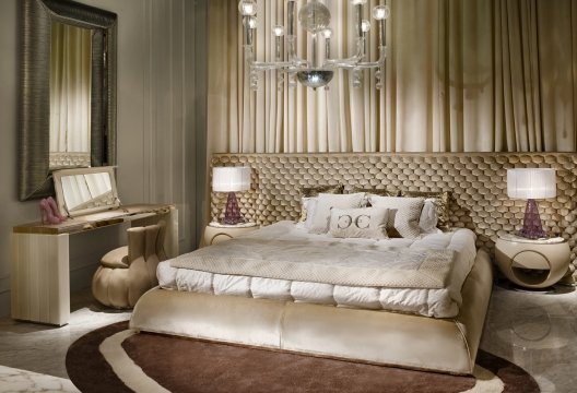 Luxurious modern interior with designer furniture, lush velvet curtains and classic chandelier in a bright sunlit room.