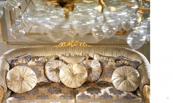 Luxurious hotel lobby interior with intricate gold elements, white marble floor and luxurious chandelier- perfect for special occasions.