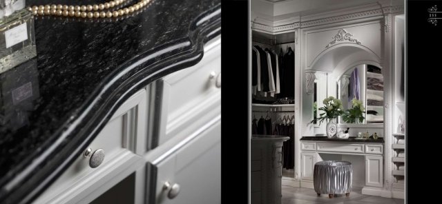 The picture shows a fully equipped modern kitchen with dark wood cabinets, marble countertop and backsplash, and numerous stainless-steel appliances. The dark wood cabinets contrast nicely with the white walls, while the silver handles and recessed lighting add a touch of elegance. The kitchen has several drawers, a sink in the corner, and a center island, making it ideal for entertaining guests.