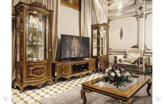 A luxurious living room with a classic brown palette, plush velvet chairs, and gilded accents that exude an air of opulence.