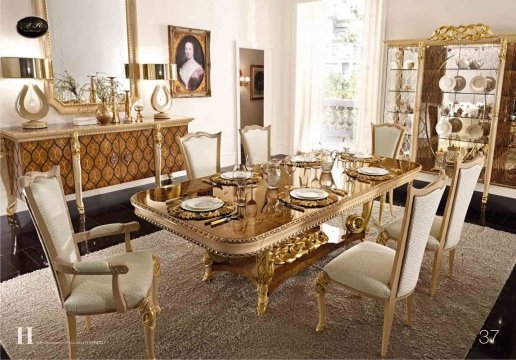 Luxurious interior of a modern bedroom with velvet curtains, golden walls and diamond-shaped chandelier.