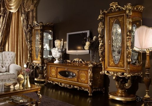 A white grandeur dining room featuring dazzling wall lights, beige marble floors and lavish walls with golden details.