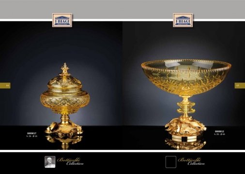 The picture is of a large, dark wood table. The table has two drawers on either side with ornate metal handles. On top of the table is a glass vase filled with white and yellow flowers.