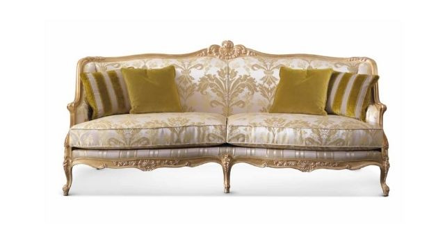 Luxury Carved sofa with fabric upholstery in gold finishing.