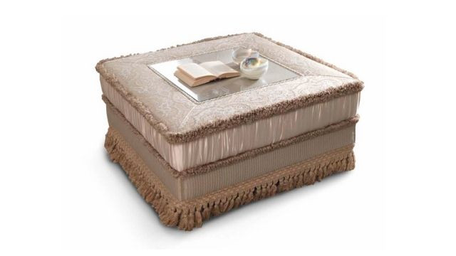 Classy Padded coffee table in fabric upholstery and with small glass top